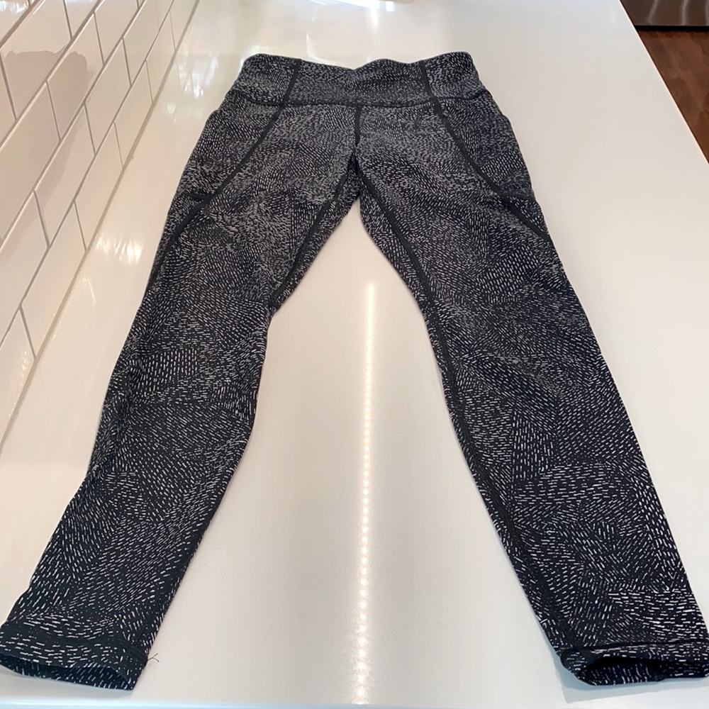 Athleta Salutation stash pocket tight.  Size XS